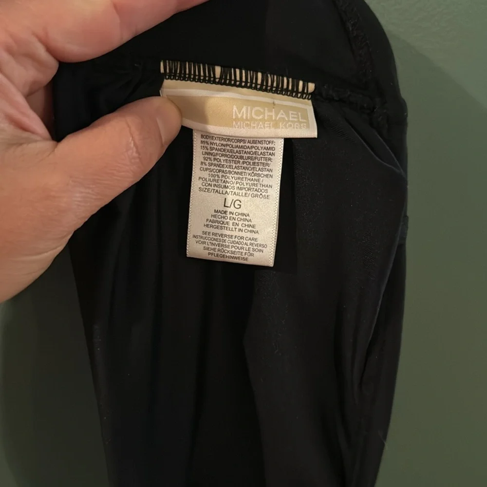 Women’s Michael Kors black swim top. Large‎